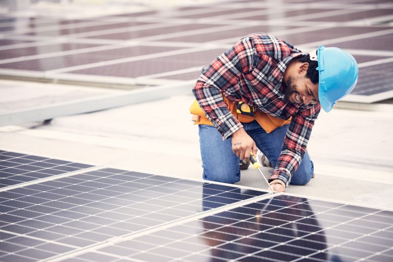 Technician Mounting Solar Panels